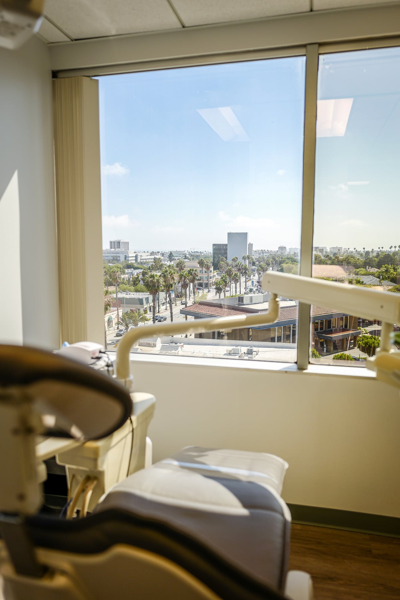 A treatment room with a city view at SCHUSTER AND OCHOCO DENTAL